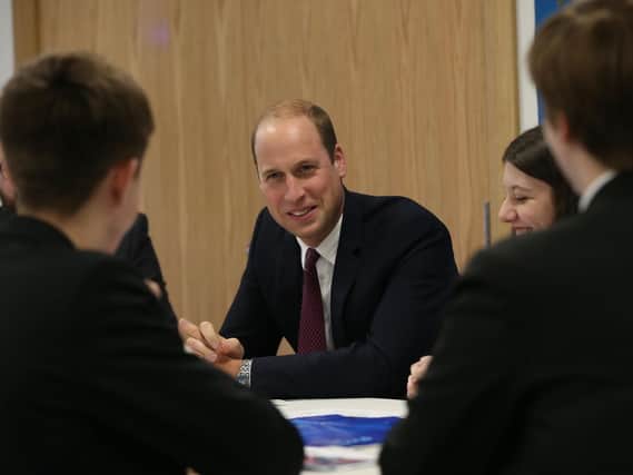 The Duke of Cambridge talks to students from Our Lady & St Patricks College, Knock during a visit to Inspire, a charity and social enterprise which focuses on promoting wellbeing for all across the island of Ireland, as part of his tour of Belfast