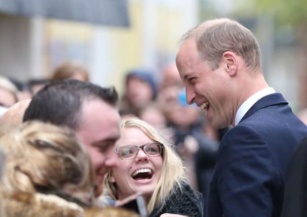 The Duke of Cambridge talks to wellwishers after his during a visit  to Inspire