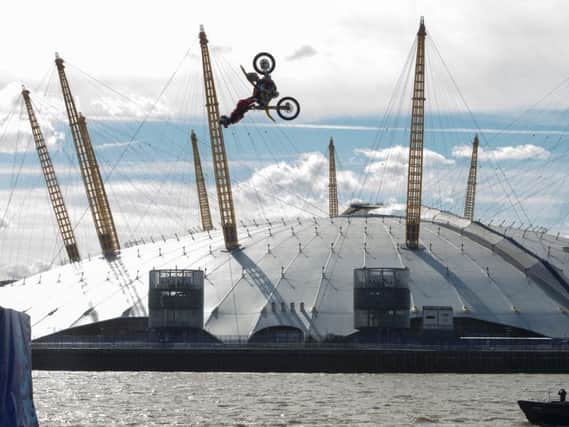 Nitro Circus ringleader and American professional motorsports competitor and stunt rider Travis Pastrana performs back-flips on a motorcycle between two floating barges in the River Thames, London, ahead of the opening at the Birmingham Arena in November of 'Nitro Circus: You Got This', which will visit 10 cities in six countries across the continent