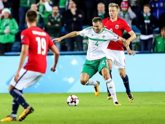Northern Ireland lost to Norway 1-0 in Oslo but had already assured their place in the World Cup qualification play-offs