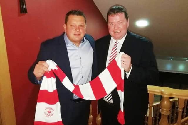 Kenny Bruce, Purplebricks estate agents, and Gareth Clements, chairman Larne FC, met with supporters on Monday evening.