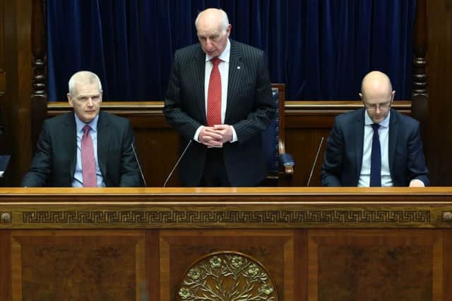 Assembly Speaker Robin Newton (centre)