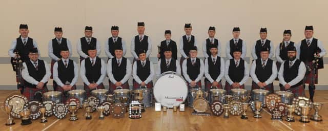 Manorcunningham Pipe Band pictured with their array of 2017 trophies at the bands practice hall in Manorcunningham on Saturday, October 7. Included are Pipe Major Gordon Carson (left in back row), Pipe Sergeant William Black (right in back row) and Drum Sergeant Alan Laird (left in front row).