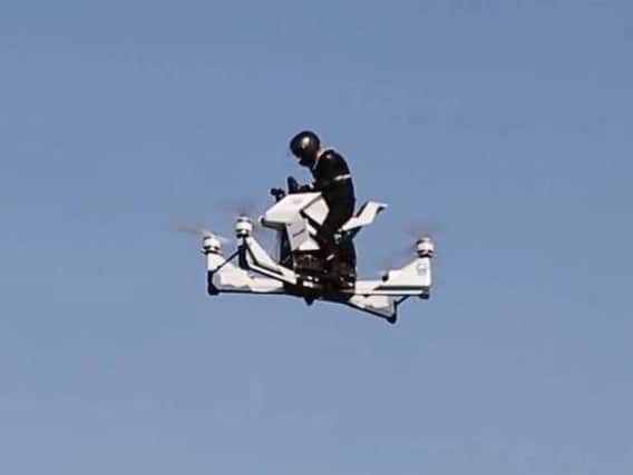 Dubai police test out the Scorpion-3 hoverbike, which manufacturer Hoversurf say has set new world records for flight height (28.5 metres) and climbing rate (5 m/s).