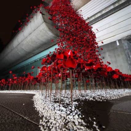 Press Eye - Belfast - Northern Ireland - 13th October 2017 - 

ICONIC POPPIES OPEN IN BELFAST
 
The iconic poppy sculpture Weeping Window by artist Paul Cummins and designer Tom Piper will open tomorrow, Saturday 14 October, at the Ulster Museum, Belfast.  The poppies will be on site until 3 December 2017 as part of the UK-wide tour organised by 14-18 NOW, the UKÃ¢Â¬"s arts programme for the First World War centenary. The poppies are presented by National Museums NI and Belfast International Arts Festival to give people from Northern Ireland and across the island of Ireland the opportunity to see the sculpture.

Photo by Darren Kidd  / Press Eye