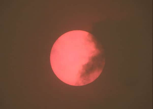 A red sun spotted in the sky over Taunton in Somerset, which was caused by Storm Ophelia. Photo: PA