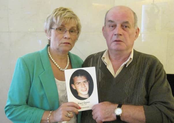 Stephen and Breege Quinn holding a photo of their murdered son Paul. Photo: David Young/PA Wire