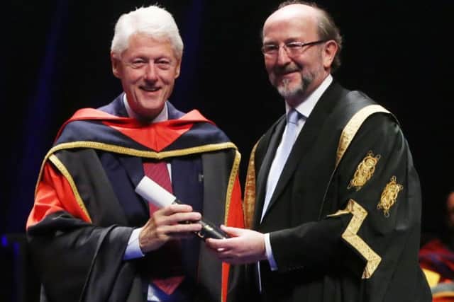 Former US president Bill Clinton (left) receives an honorary doctorate from Dublin City University president Brian MacCraith, in Dublin