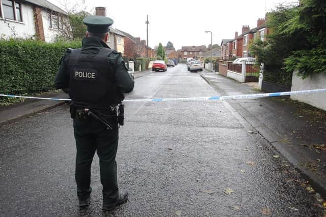 Police cordoned off the scene around the house in Finaghys Ardmore Avenue as a murder investigation began