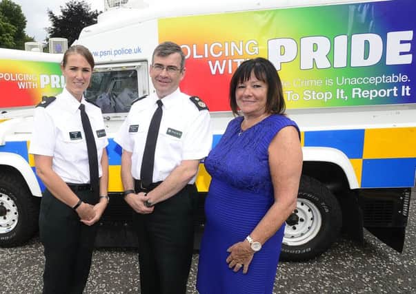 PSNI Supt Emma Bond, Deputy Chief Constable Drew Harris and Anne Connolly, chair of NI Policing Board, publicising the PSNIs participation in the Belfast Pride event earlier this year