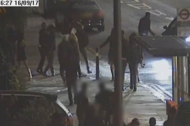 Handout CCTV images issued by Metropolitan Police dated 16/9/2017 of the incident where a car (right obscured) deliberately rammed pedestrians outside the Mekan Restaurant and Bar in Catford, south London which left a man "unconscious" on the pavement
