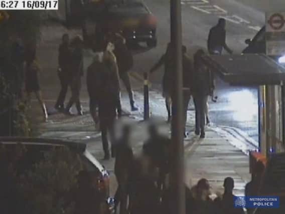 Handout CCTV images issued by Metropolitan Police dated 16/9/2017 of the incident where a car (right obscured) deliberately rammed pedestrians outside the Mekan Restaurant and Bar in Catford, south London which left a man "unconscious" on the pavement