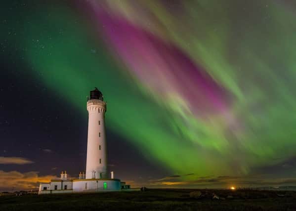 The Aurora Borealis lighting up the sky over Covesea Lighthouse, near Lossiemouth. Pic by Alan Butterfield, Moray Speyside Tourism