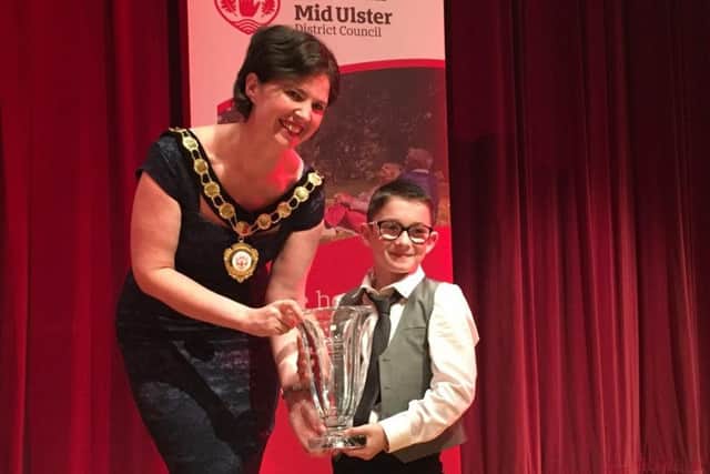 Jack receives his award from the Mid Ulster Council