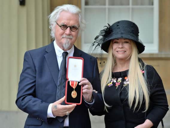 Sir Billy Connolly with his wife Pamela Stephenson after being knighted by the Duke of Cambridge during an Investiture ceremony at Buckingham Palace