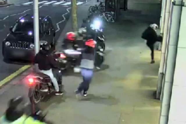 Footage issued by the Metropolitan Police of the moment a moped gang swarmed on a designer shop