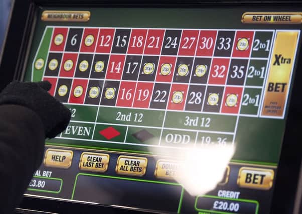 The government is to consult on reducing the maximum stake on fixed-odds betting terminals