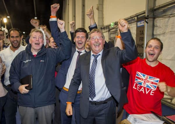 DUP MP Sammy Wilson (second from right) celebrates with Leave supporters at the Titanic Exhibition Centre, Belfast, after the Leave campaign claimed victory in the EU referendum on June 24 2016. Photo: Liam McBurney/PA Wire