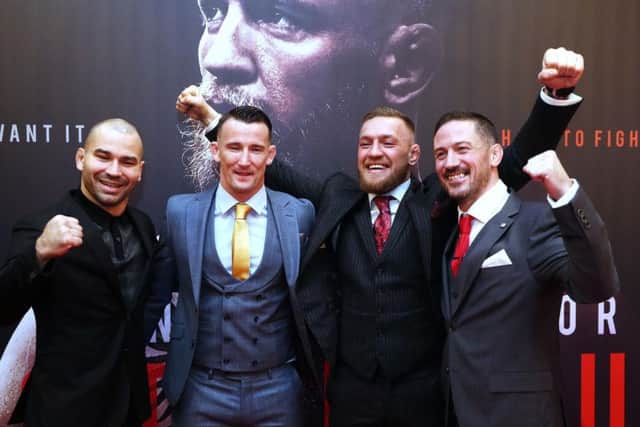 Conor McGregor with head coach John Kavanagh (right) MMA fighter Artem Lovov (left) and coach Owen Roddy on arrival at the Conor McGregor: Notorious premiere at the Savoy Cinema in Dublin