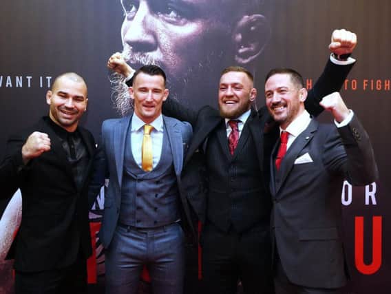 Conor McGregor with head coach John Kavanagh (right) MMA fighter Artem Lovov (left) and coach Owen Roddy on arrival at the Conor McGregor: Notorious premiere at the Savoy Cinema in Dublin
