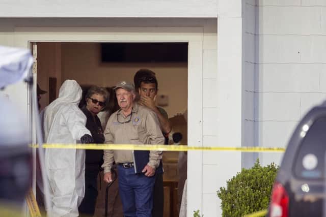 Investigators work at the scene of a mass shooting at the First Baptist Church in Sutherland Springs, Texas,  on Sunday, Nov. 5, 2017
