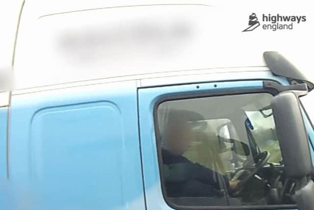 Handout still from undated footage released by Highways England showing an HGV driver with his right foot on the dashboard while traveling from the M18 onto the M62 near Goole