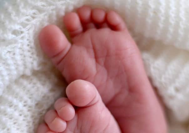 File photo dated 11/07/14 of a new born baby's feet. Photo: Andrew Matthews/PA Wire