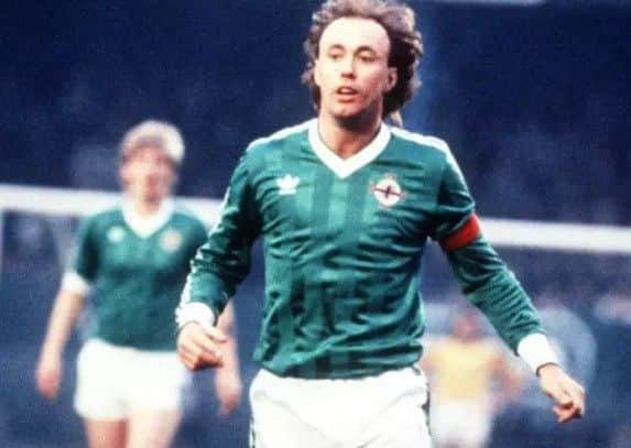 Sammy McIlroy in action for his country