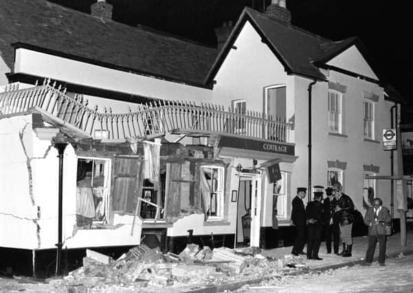 The aftermath of an IRA bomb attack on the Horse and Groom pub in Guildford.