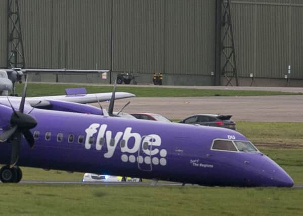 Flybe BE331 on the tarmac after it landed with no nose gear at Belfast International Airport. Photo: Liam McBurney/PA Wire