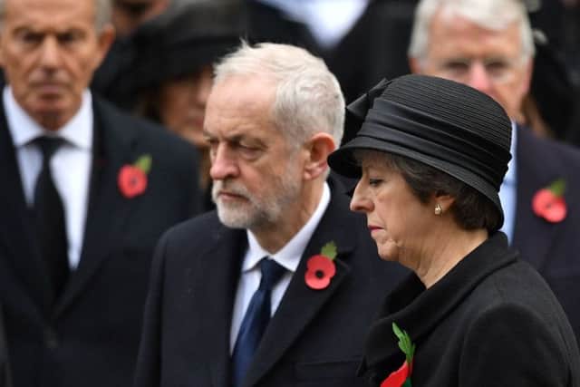 Prime Minister Theresa May stands with Labour leader Jeremy Corbyn, with former prime ministers Tony Blair (left) and Sir John Major (right) ,during the annual Remembrance Sunday Service at the Cenotaph memorial in Whitehall, central London