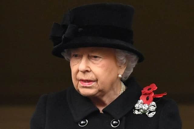 The Queen Elizabeth observes the annual Remembrance Sunday Service at the Cenotaph memorial from a balcony in Whitehall, central London