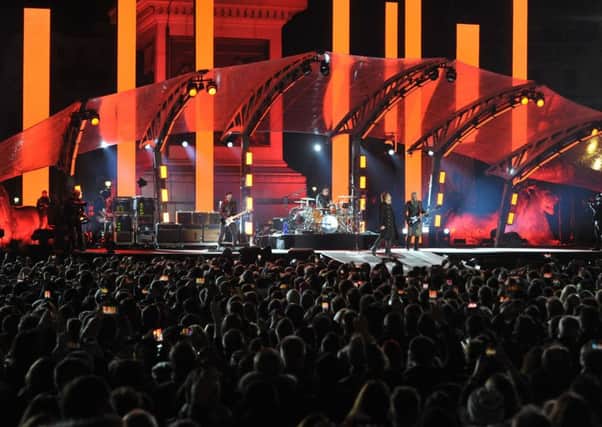 U2 perform in Trafalgar Square, London