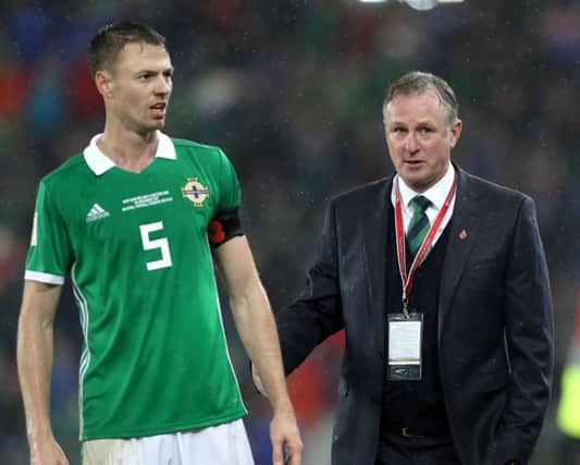 Northern Ireland manager Michael O'Neill with Jonny Evans
