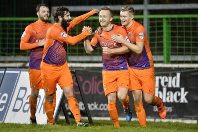 Glenavon's Sammy Clinghan celebrates after his second penalty put his side into a 3-1 lead at The Oval. Â©INPHO/Stephen Hamilton