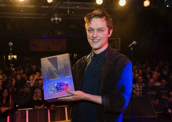 Joshua Burnside is presented with his award