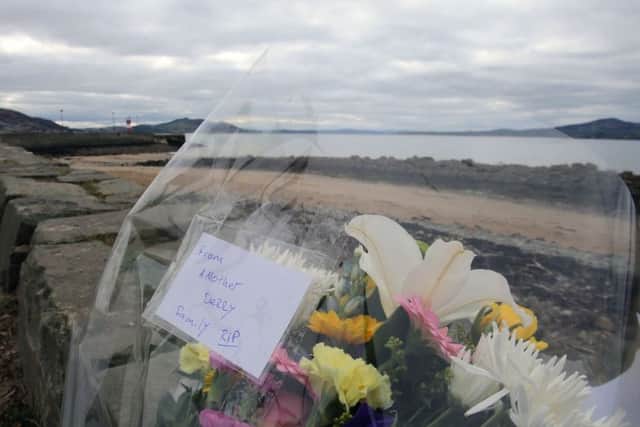 Flowers left at the scene at Buncrana Pierin the days following of the tragedy. (Niall Carson/PA Wire)