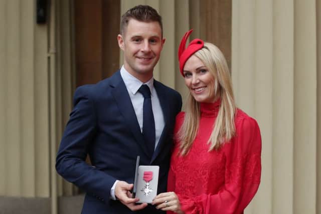 Jonathan Rea with his wife Tatia, after being presented with an MBE by the Duke of Cambridge, at Buckingham Palace, London.