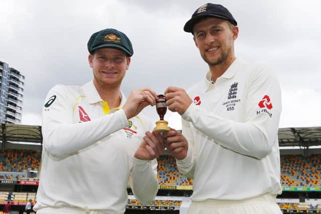 England's Joe Root and Australia's Steve Smith pose for a photo during a press conference at The Gabba, Brisbane. PRESS ASSOCIATION Photo.