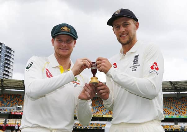 England's Joe Root and Australia's Steve Smith pose for a photo during a press conference at The Gabba, Brisbane. PRESS ASSOCIATION Photo.