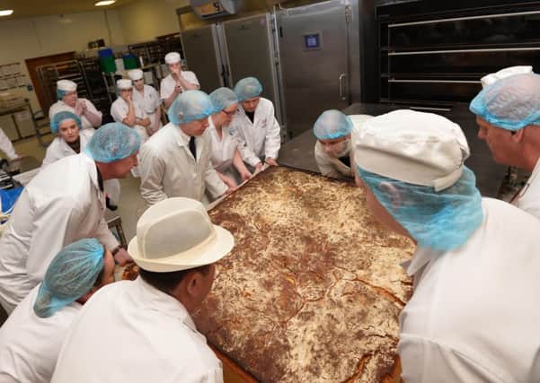 The giant scone emerges from the oven. 

Pic Colm Lenaghan/Pacemaker